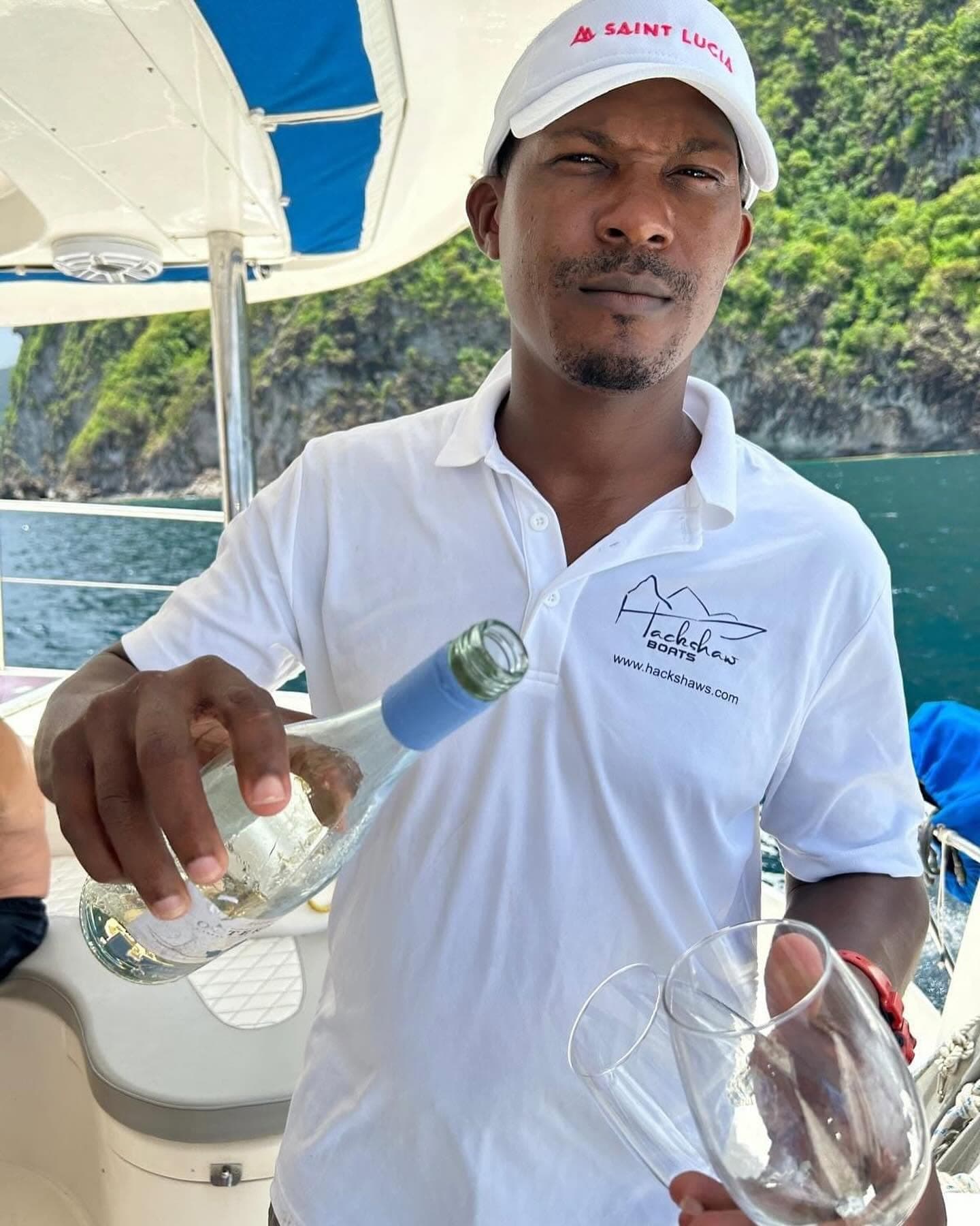 Crew pouring champagne for guests aboard 50ft Luxury Power Cat